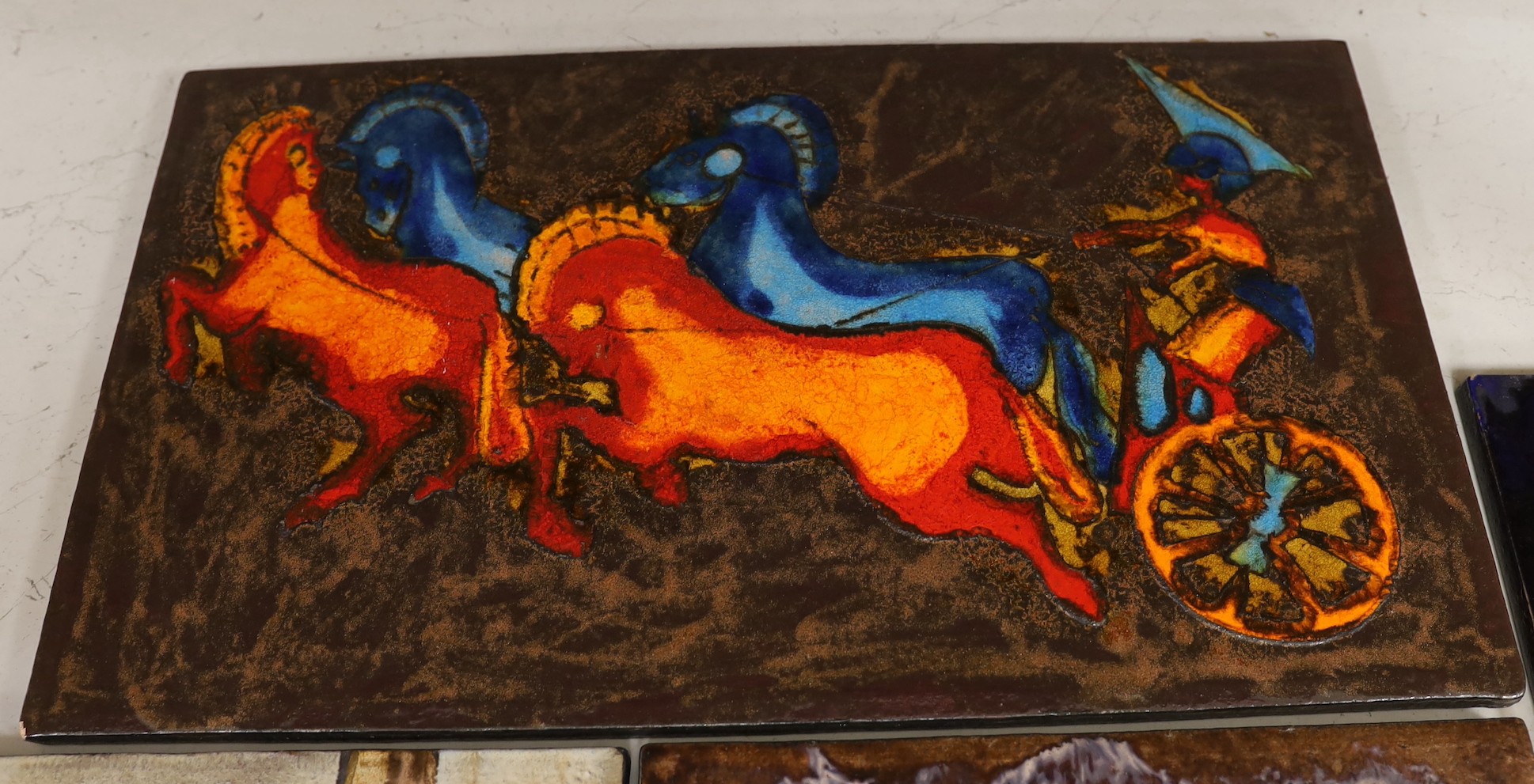 Two West German Ruscha pottery wall plaques and two studio pottery metallic glazed plaques. Largest 35x60cm